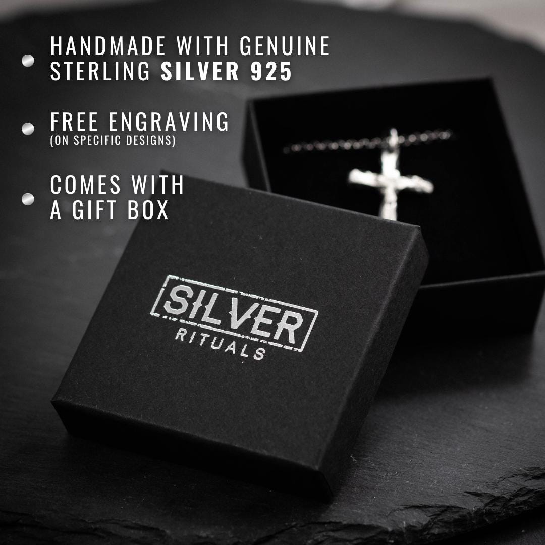 a black box with a silver cross on it
